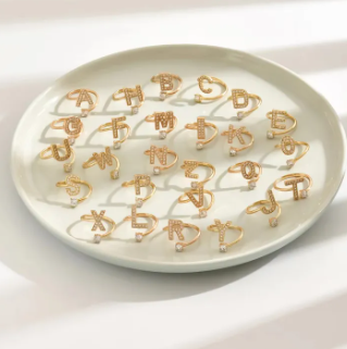 Golden Alphabet Rings on Plate