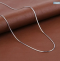 Silver Thin Snake Chain Necklace on leather background